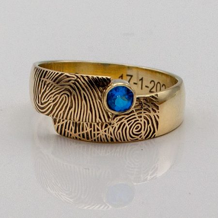Trouwring-vermaakt-in-nieuwe-ring-met-blauwe-steen